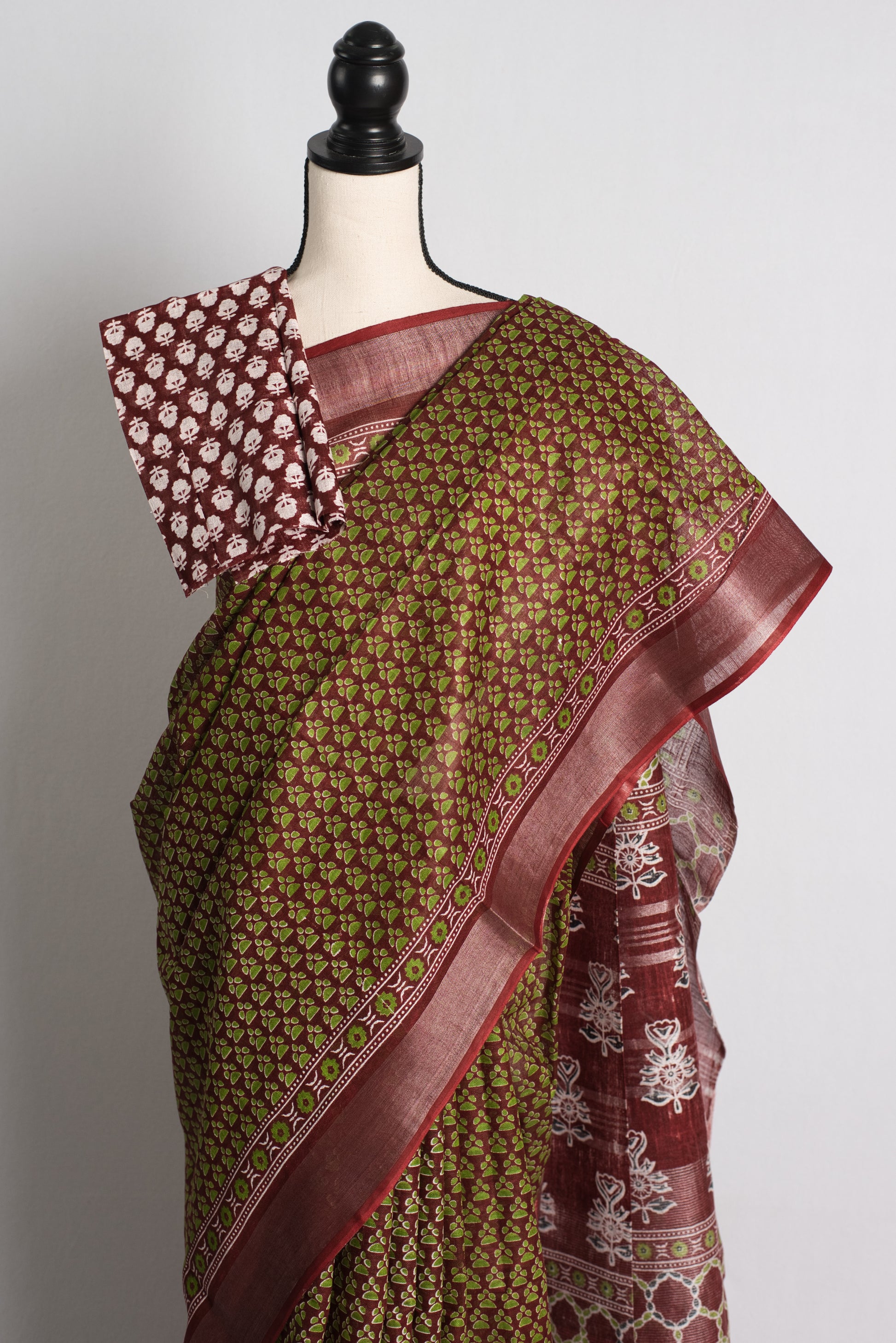Printed Staple Cotton Saree in Green and Maroon.