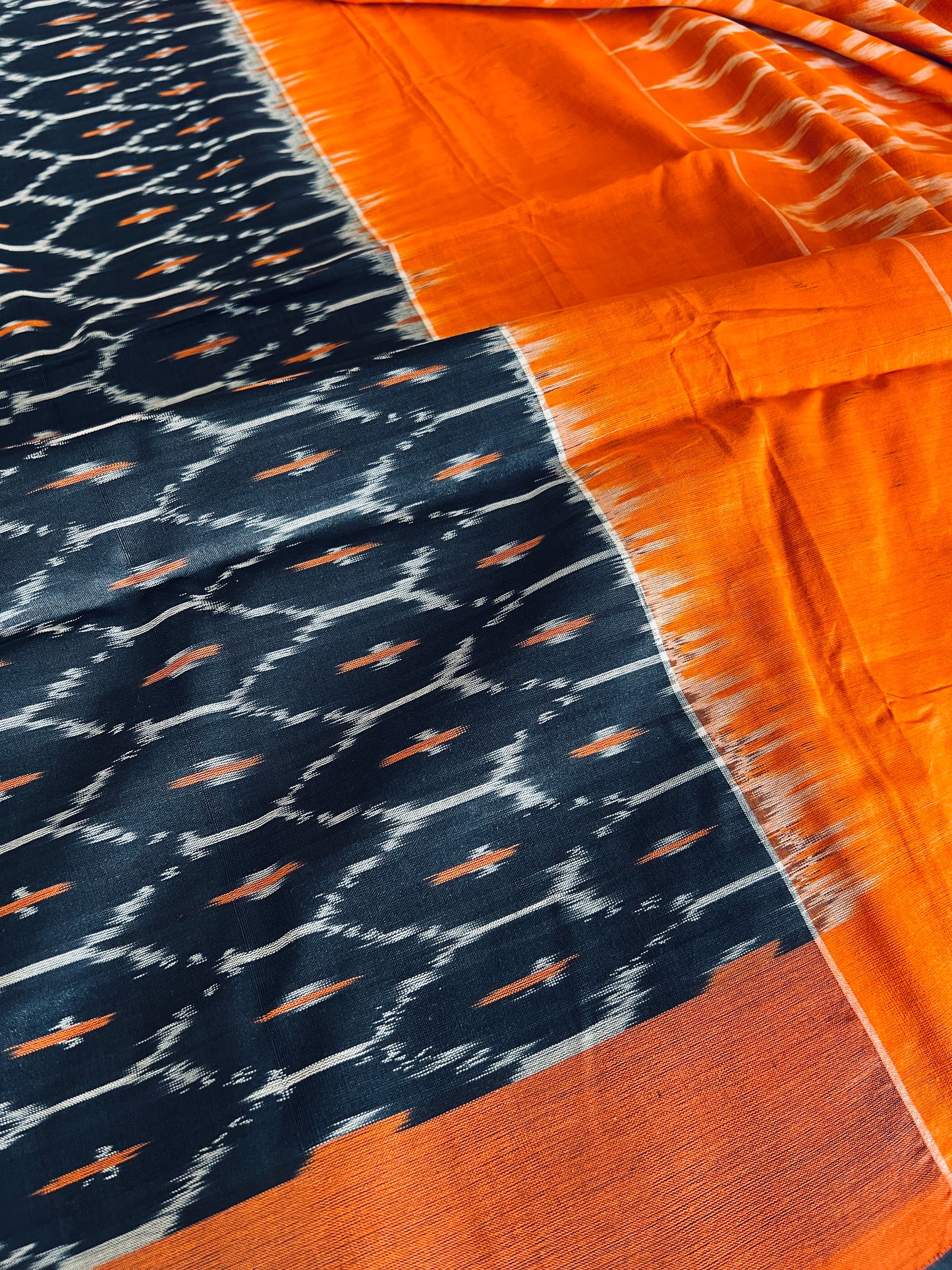 Blended Cotton Pochampally Saree in Black and Orange.