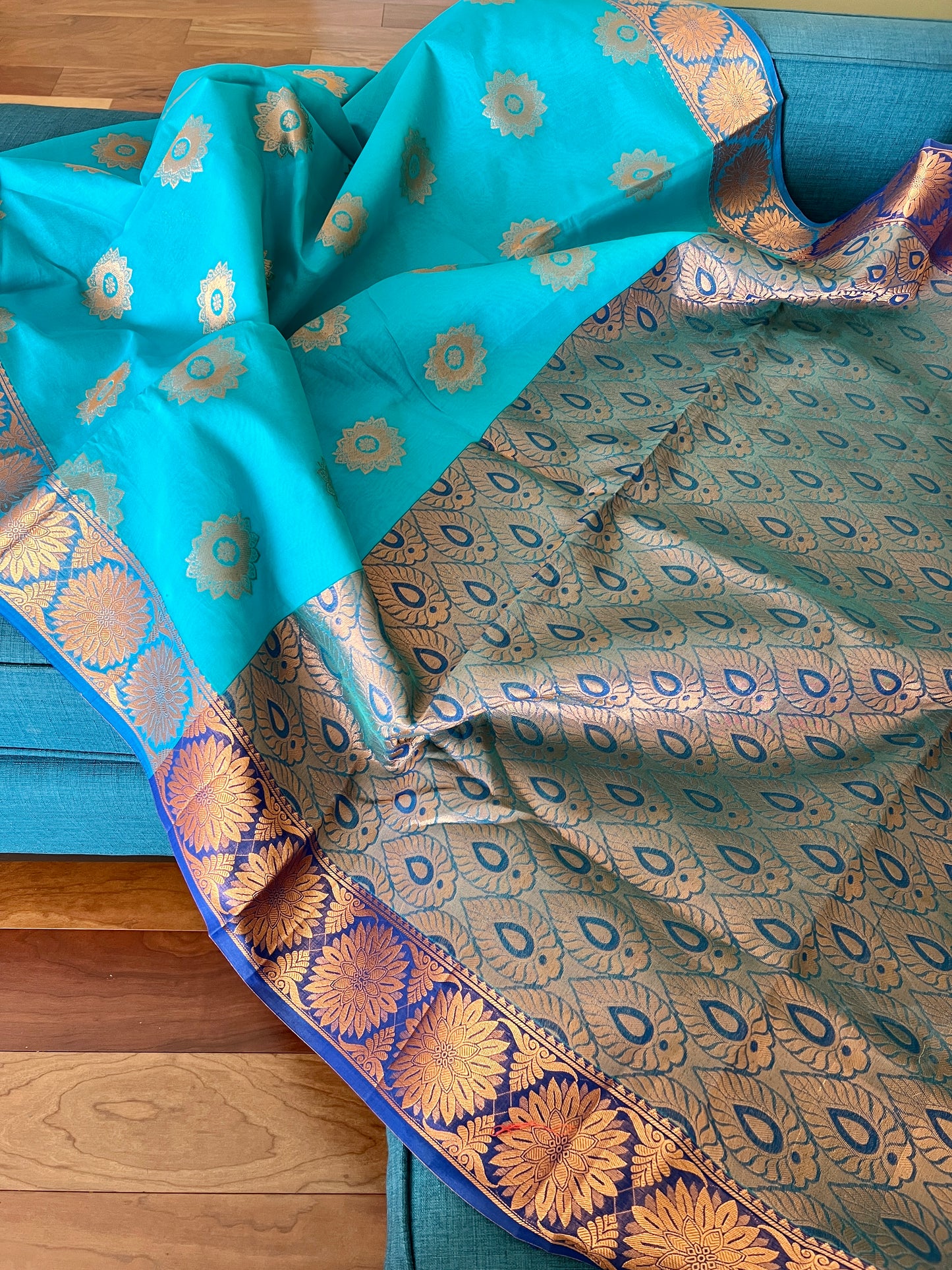 Turquoise Blue Blended Cotton Banarasi Saree with Gold Motif.