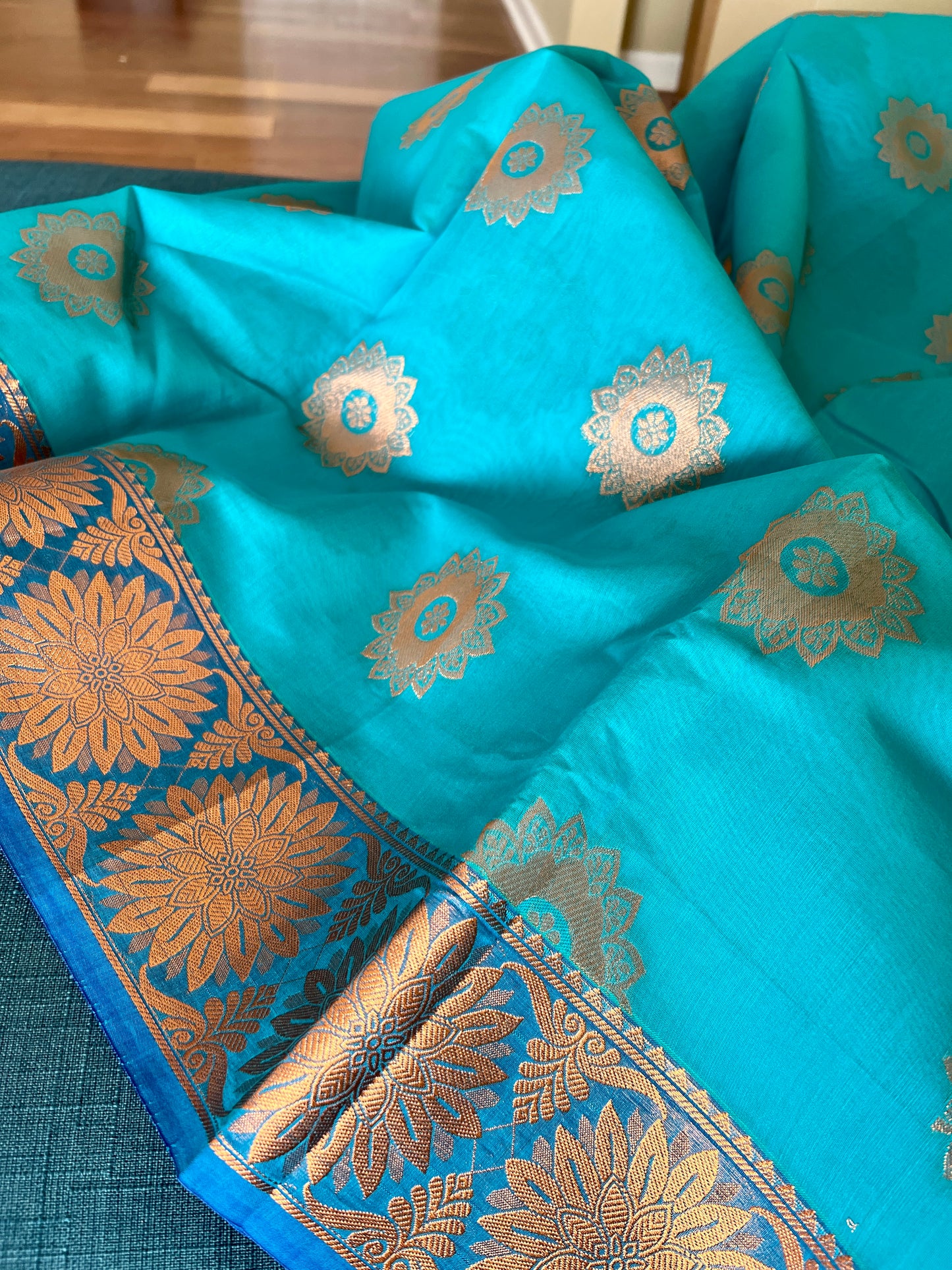 Turquoise Blue Blended Cotton Banarasi Saree with Gold Motif.