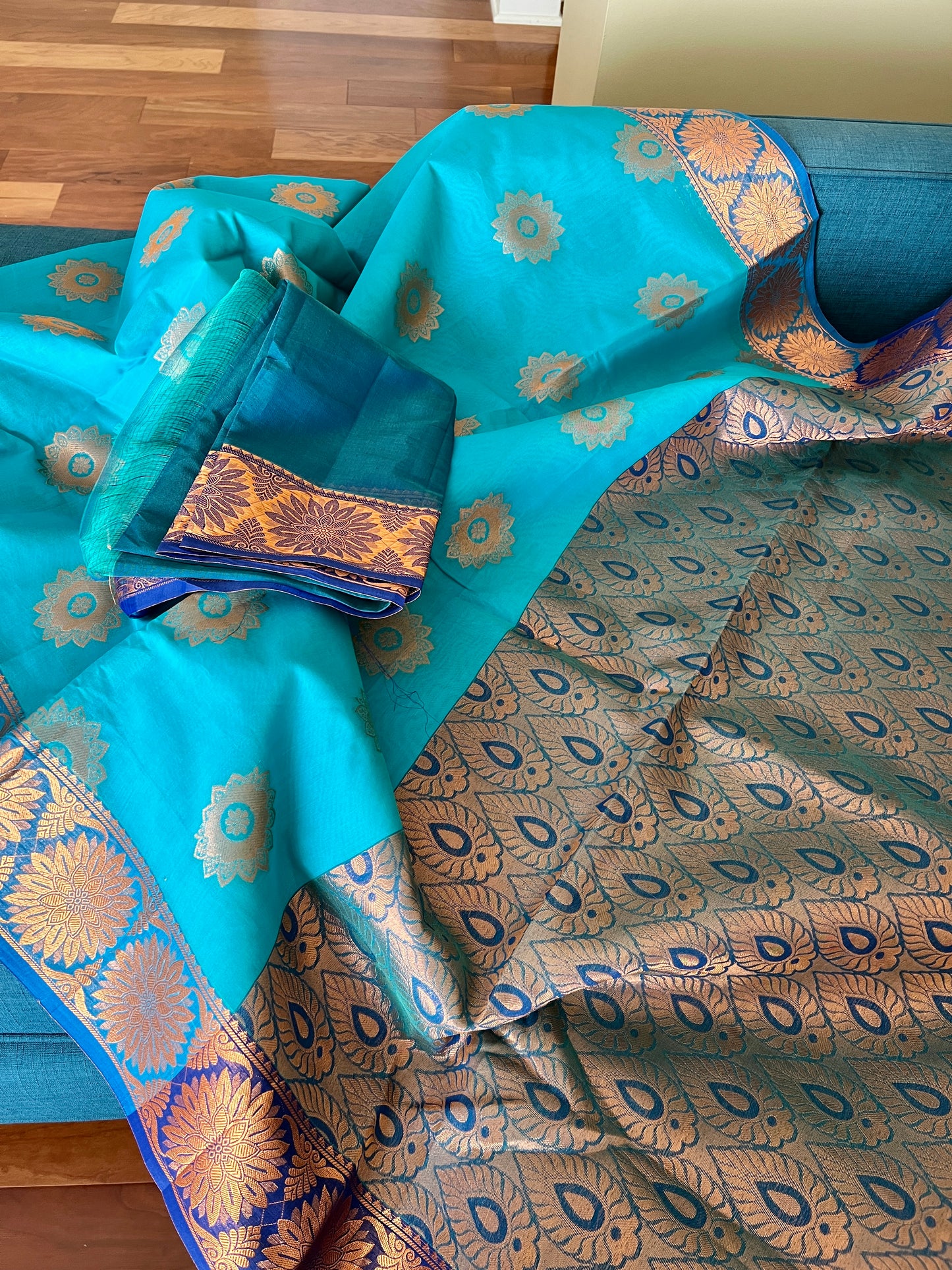 Turquoise Blue Blended Cotton Banarasi Saree with Gold Motif.