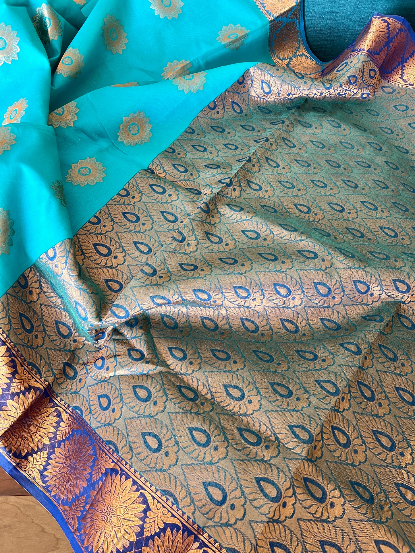Turquoise Blue Blended Cotton Banarasi Saree with Gold Motif.