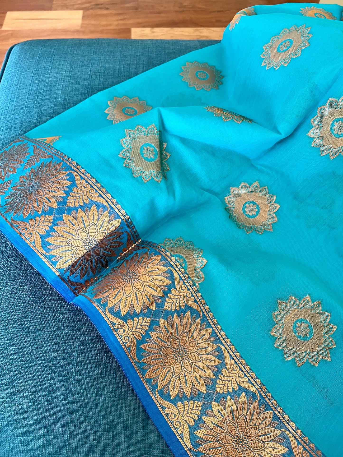Turquoise Blue Blended Cotton Banarasi Saree with Gold Motif.