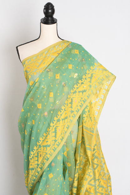 A refreshing sea green and yellow blended Jamdani saree in soft cotton, featuring traditional Bengali hand-loomed motifs and a delicate drape.