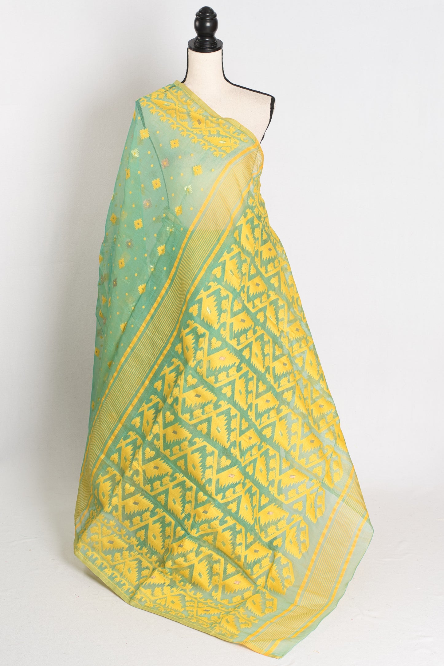 A refreshing sea green and yellow blended Jamdani saree in soft cotton, featuring traditional Bengali hand-loomed motifs and a delicate drape.