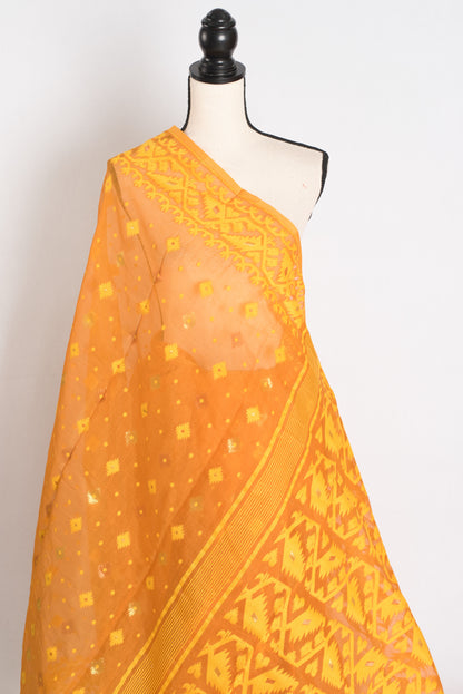 An earthy brown and yellow blended Jamdani saree in soft cotton, featuring traditional Bengali hand-loomed motifs and a sophisticated matte finish.
