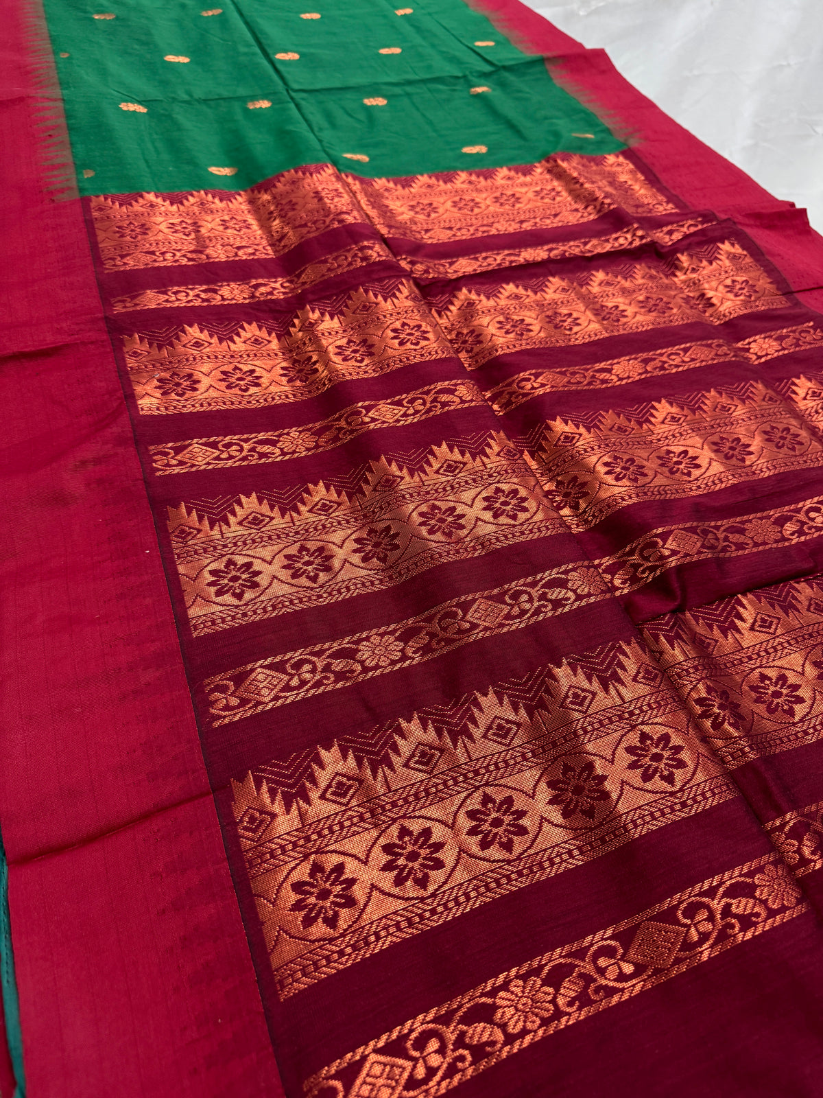 Gayetri: Dark Green Blended Cotton Gadwal Saree with Antique Zari Butis image 1