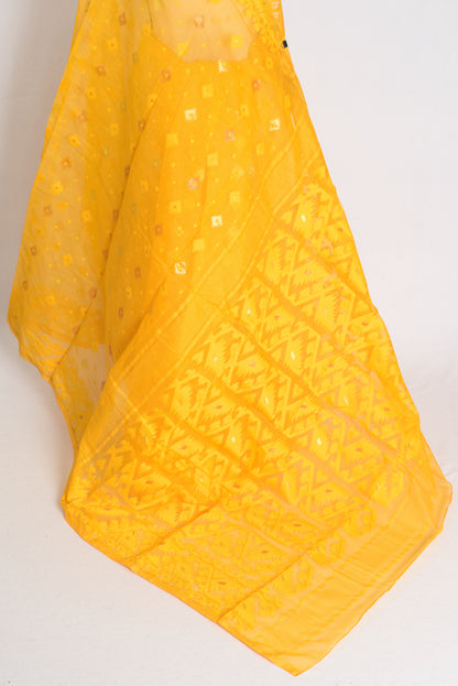 A vibrant deep yellow Bengali Jamdani saree crafted from a soft cotton blend, featuring traditional hand-loomed patterns perfect for festive occasions.
