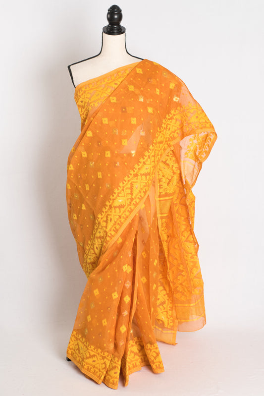 An earthy brown and yellow blended Jamdani saree in soft cotton, featuring traditional Bengali hand-loomed motifs and a sophisticated matte finish.