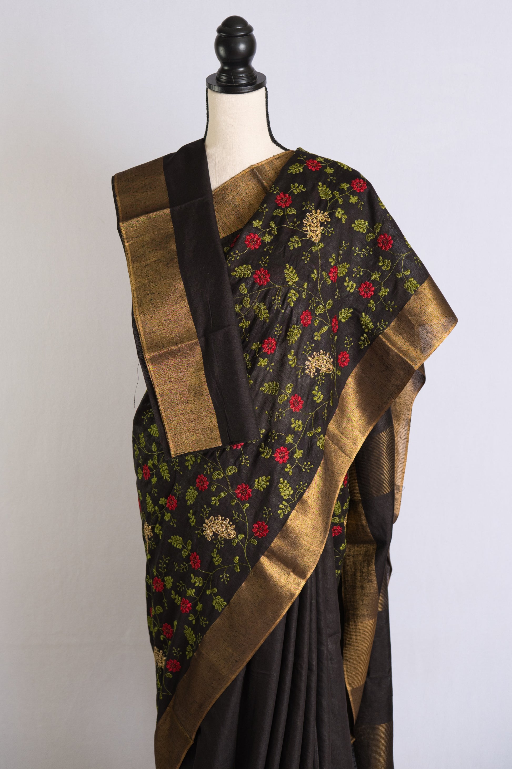 Semi Tussar Embroidery Saree in Black with Gold Border.