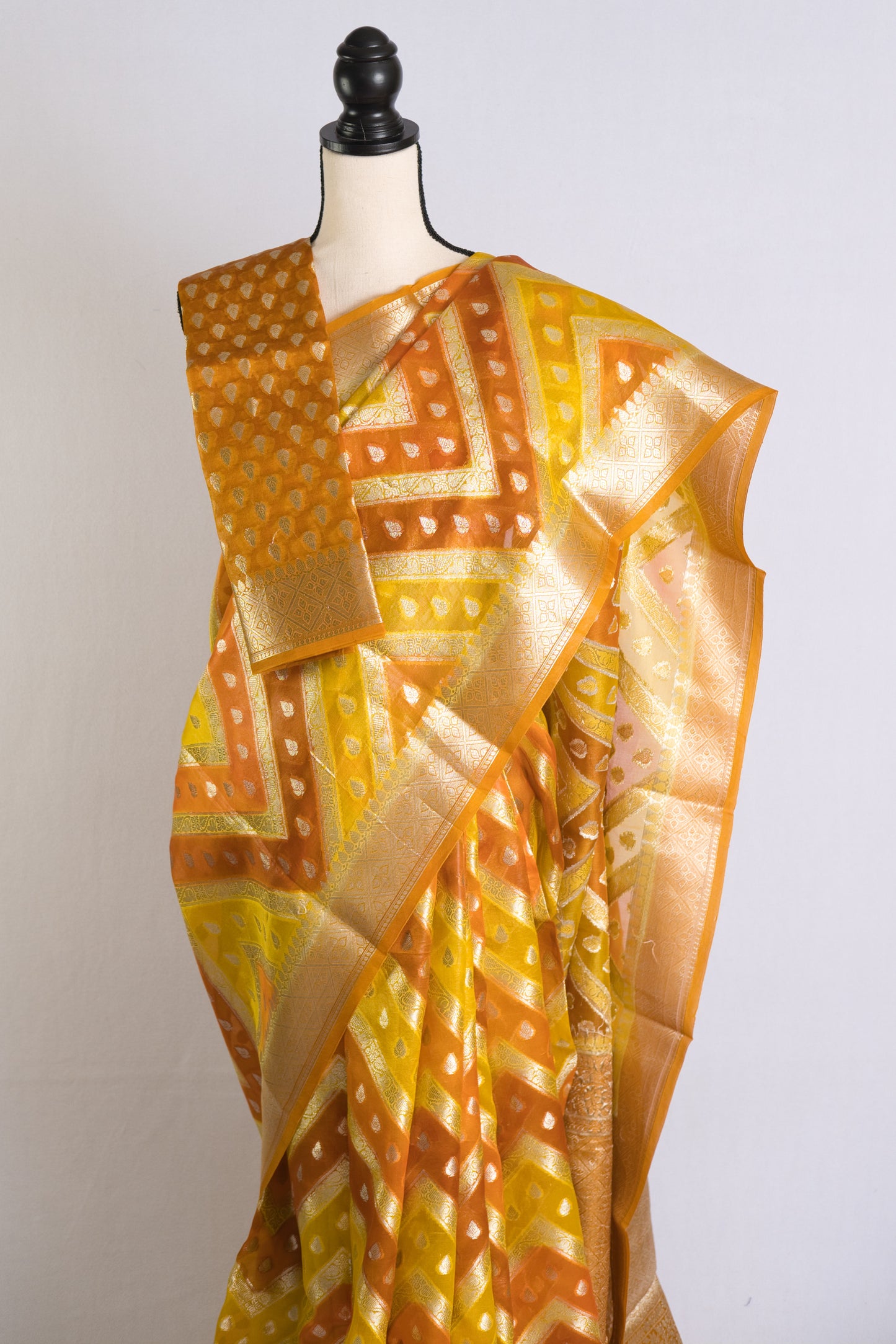 Silk Mark Certified Kora Rangkat Banarasi Saree in Yellow, Orange and Silver.