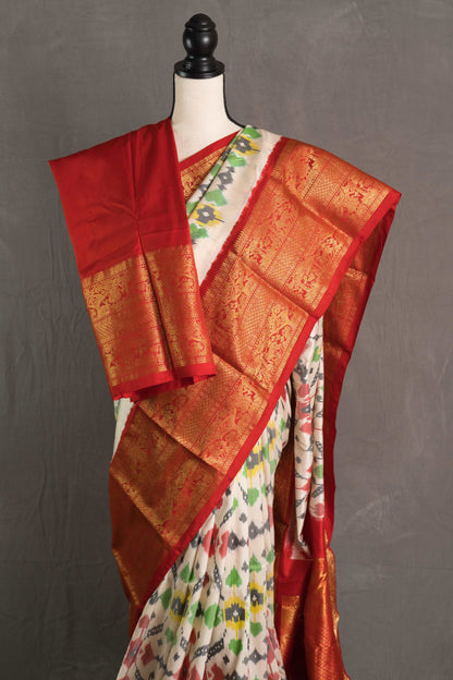 Ikkat Pochampally Saree with Kanjivaram Saree in Off White and Red.