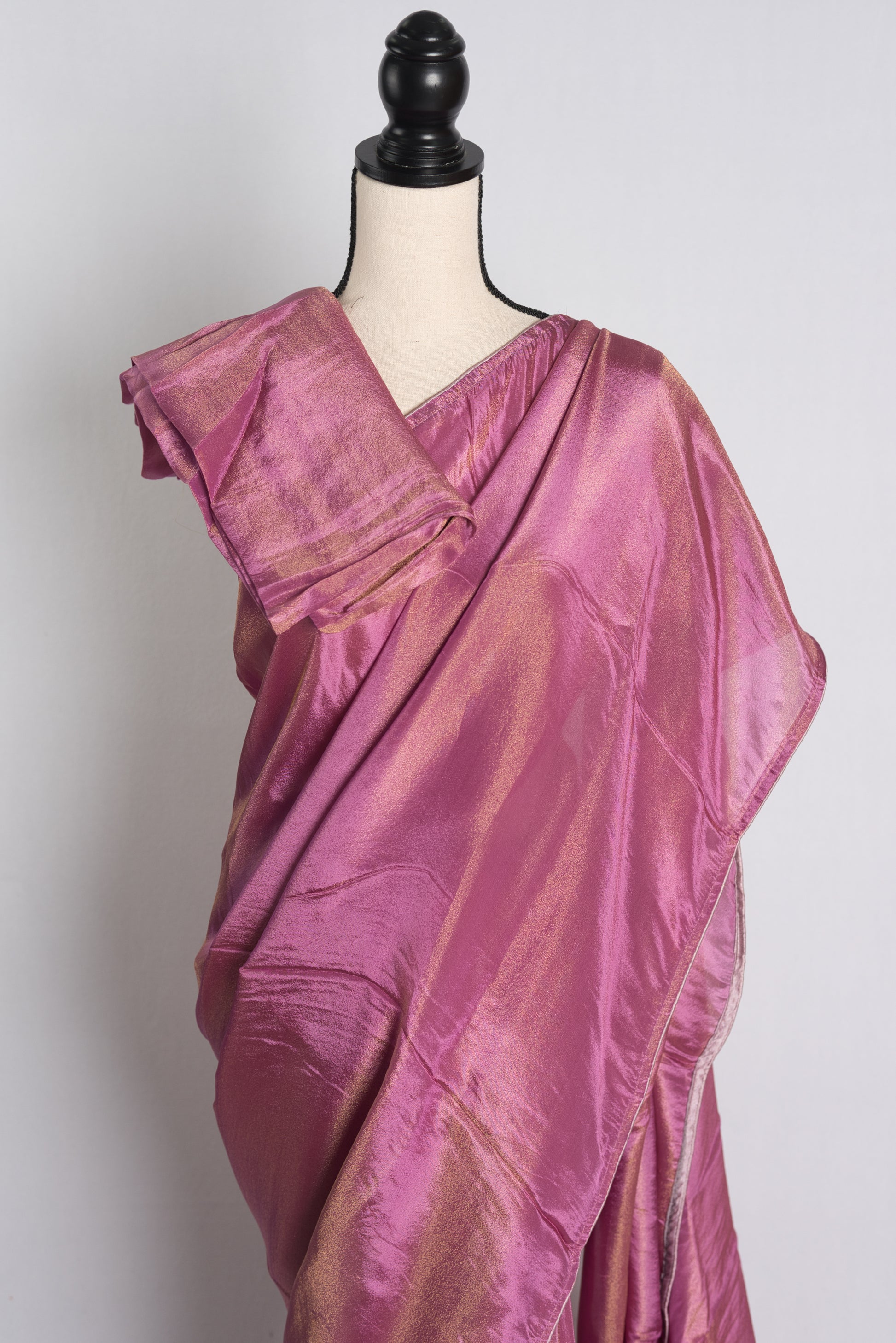 Soft Designer Tissue Saree in Purple with a Shimmer of Gold.