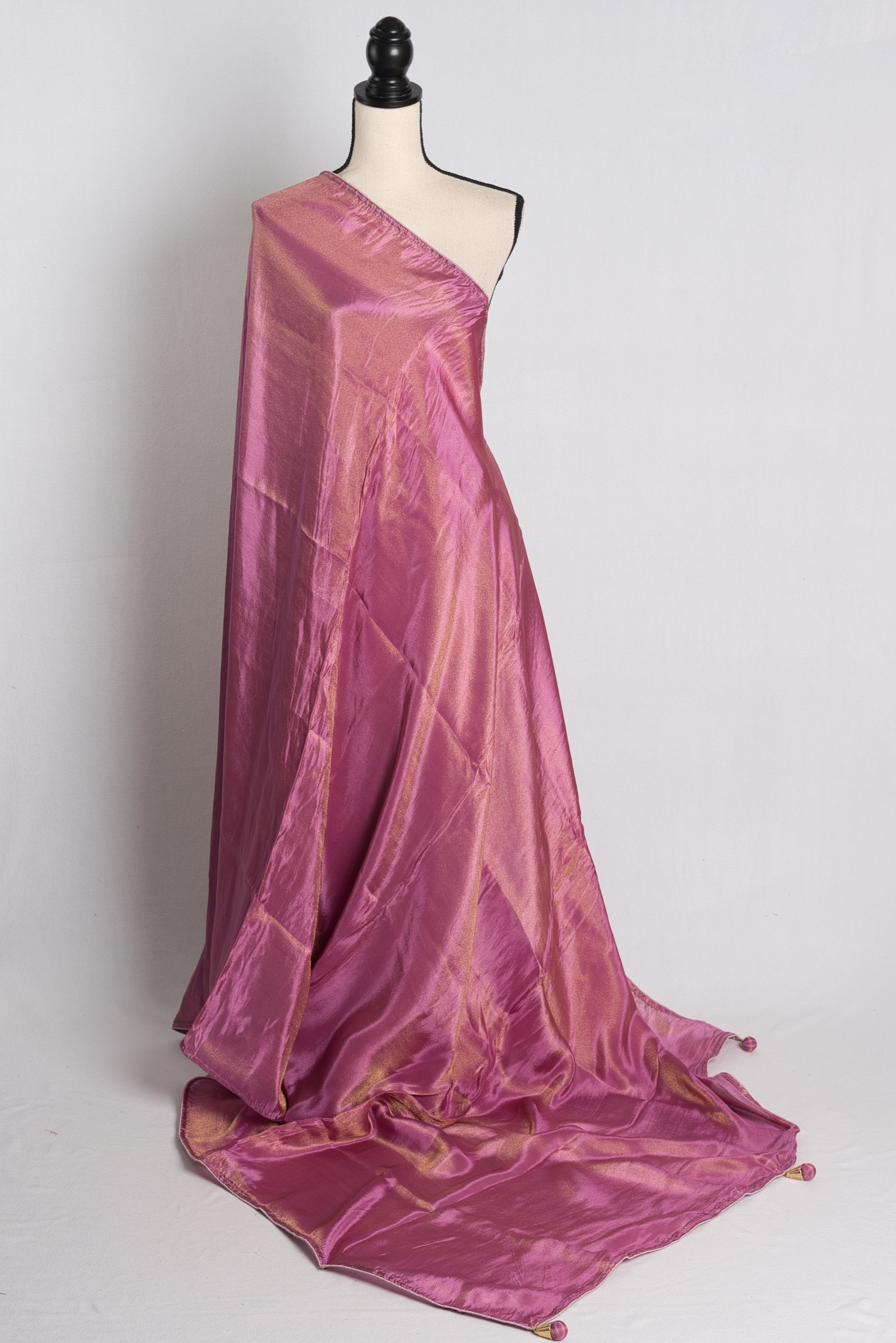 Soft Designer Tissue Saree in Purple with a Shimmer of Gold.