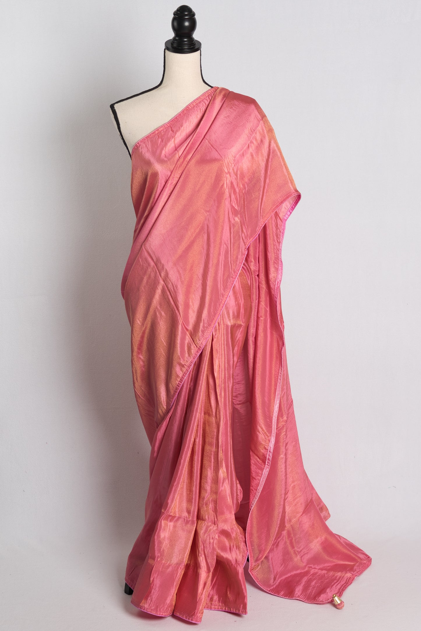 Soft Designer Tissue Saree in Pink with a Shimmer of Gold.