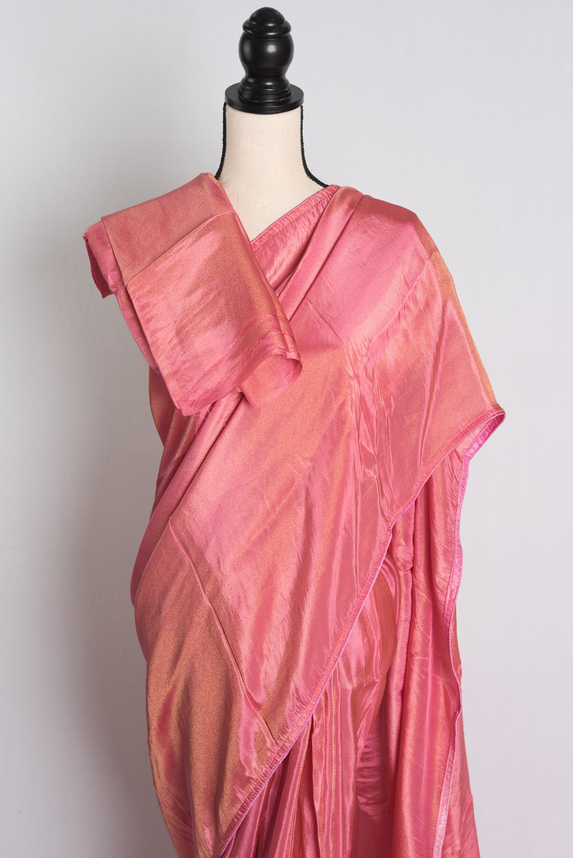 Soft Designer Tissue Saree in Pink with a Shimmer of Gold.