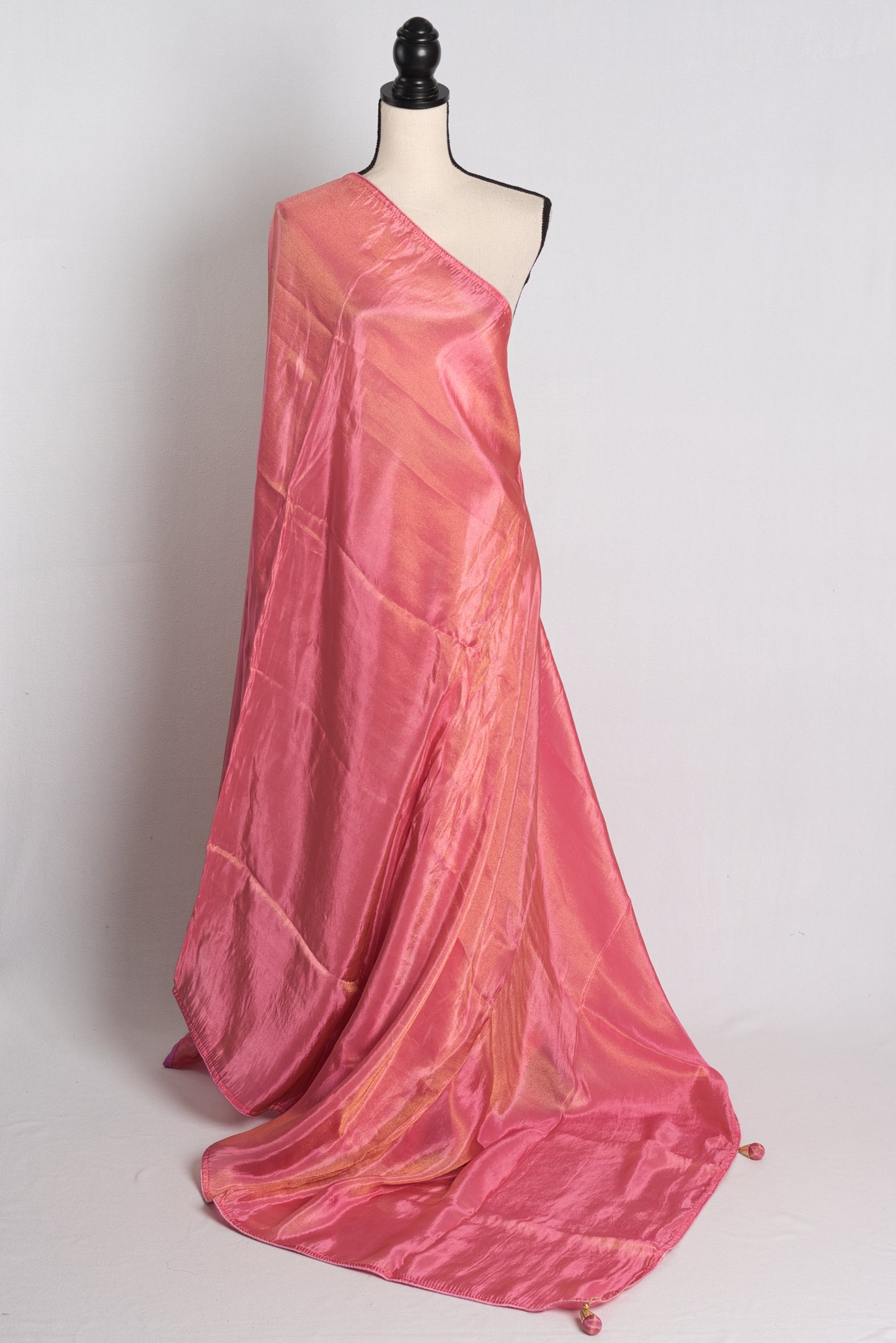 Soft Designer Tissue Saree in Pink with a Shimmer of Gold.