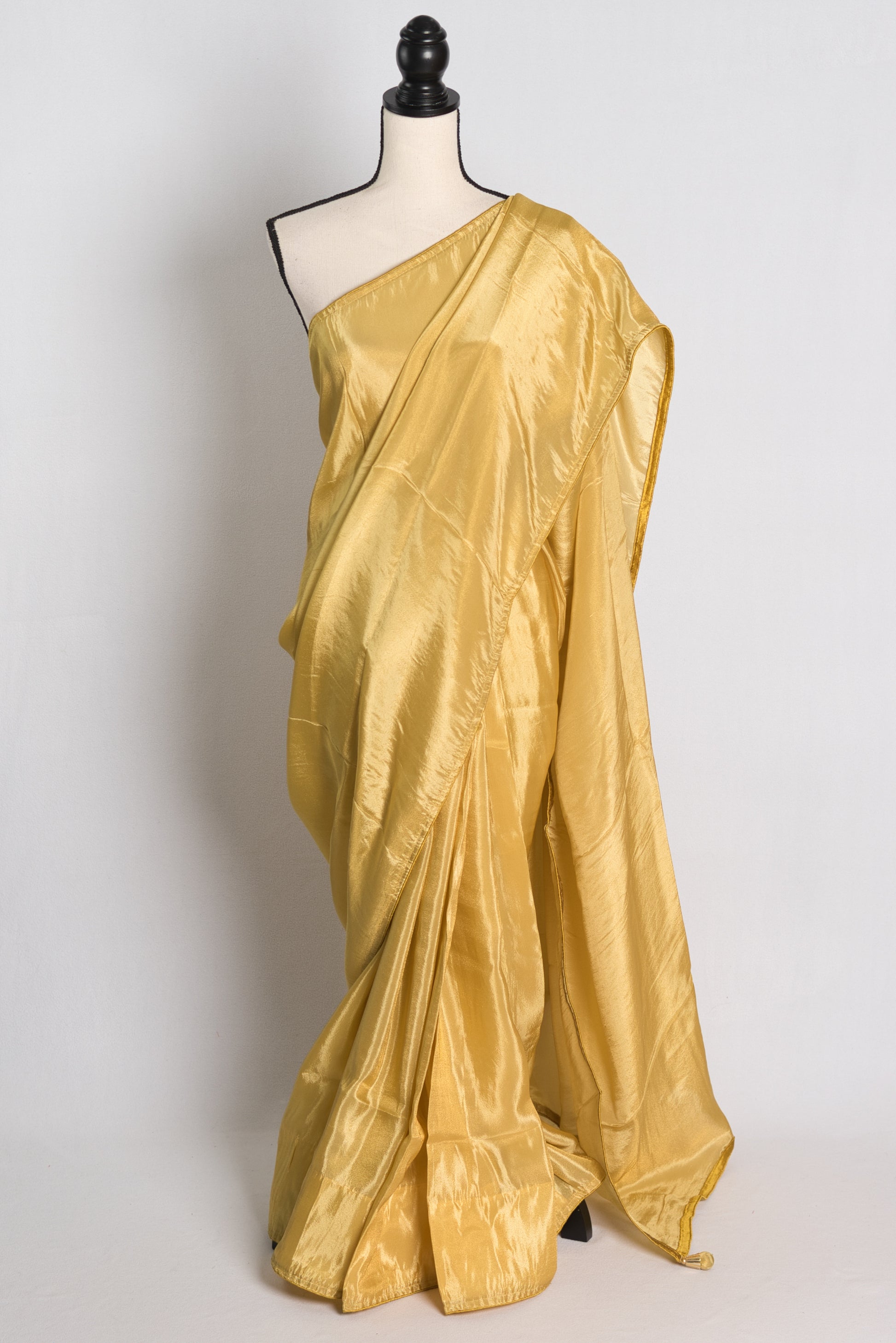 Soft Designer Tissue Saree in Gold.