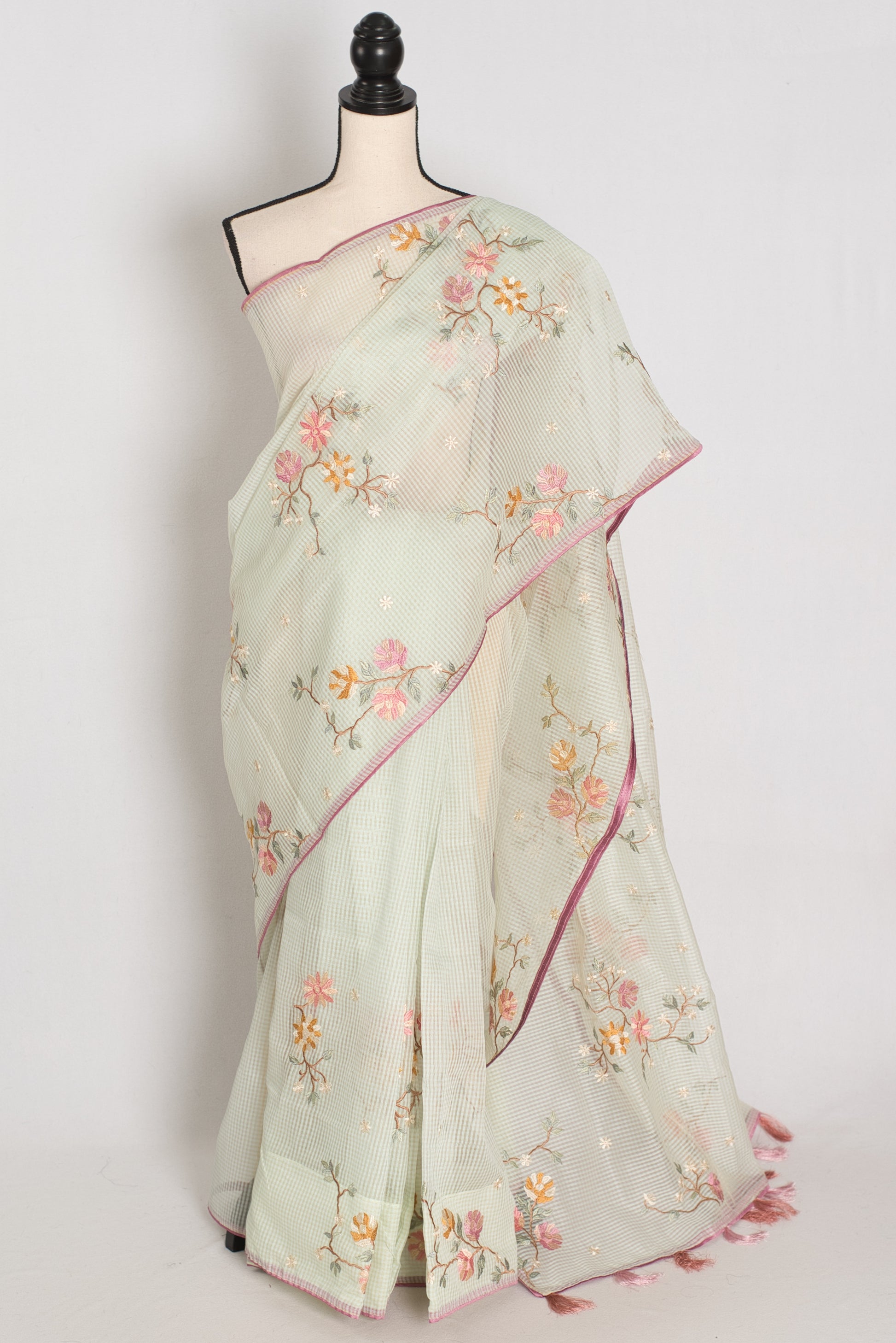 Sea green blended cotton kota saree with floral embroidery, self checks pattern, and pink piping border.