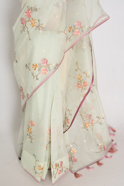Sea green blended cotton kota saree with floral embroidery, self checks pattern, and pink piping border.