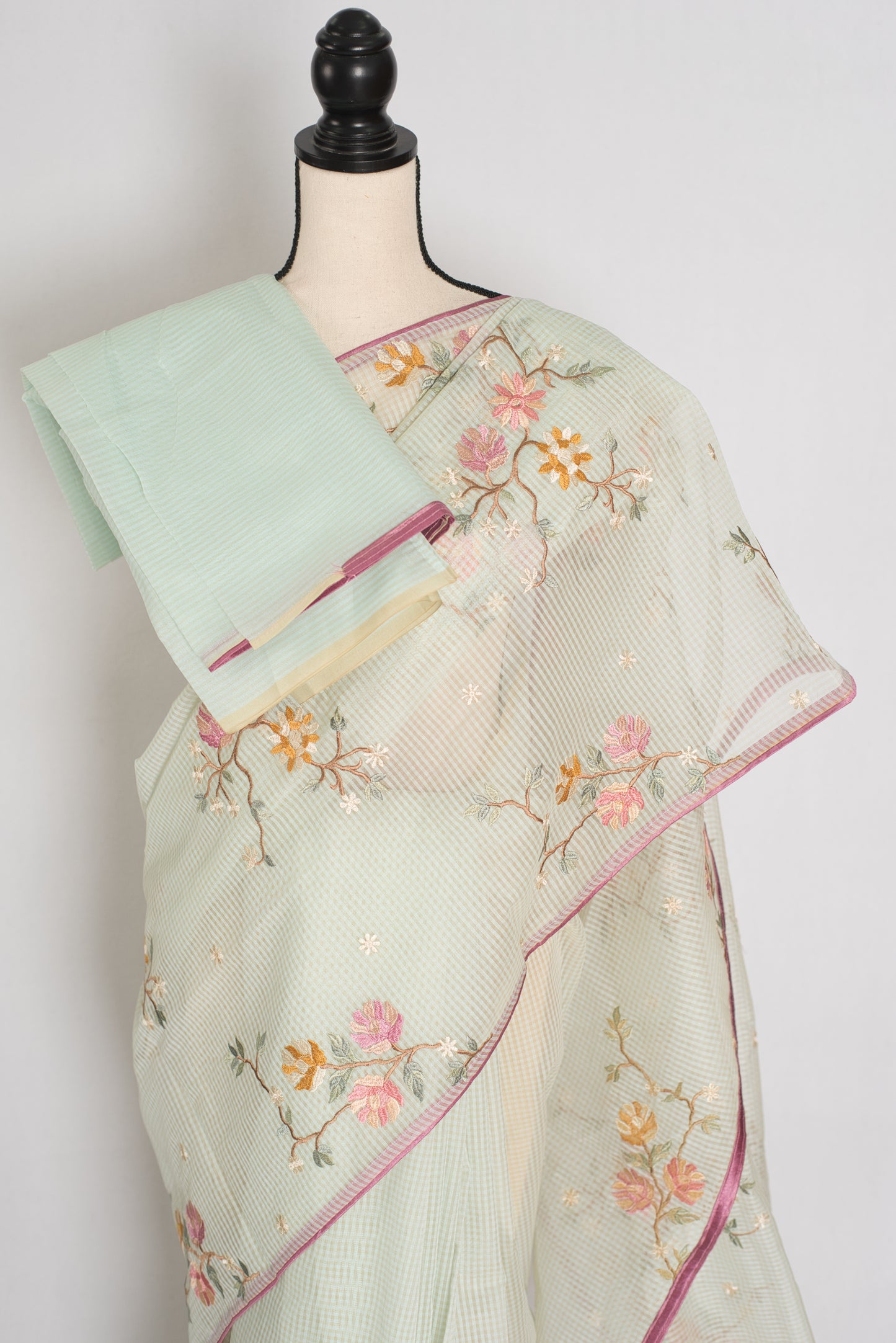 Sea green blended cotton kota saree with floral embroidery, self checks pattern, and pink piping border.