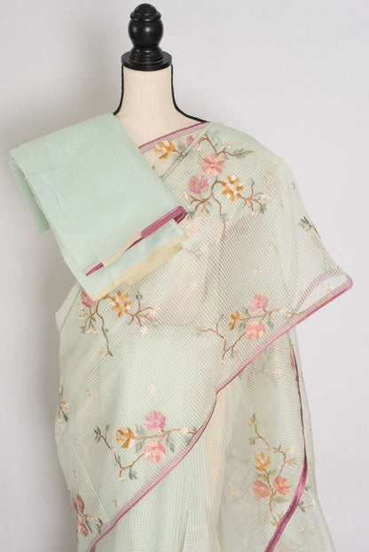 Sea green blended cotton kota saree with floral embroidery, self checks pattern, and pink piping border.