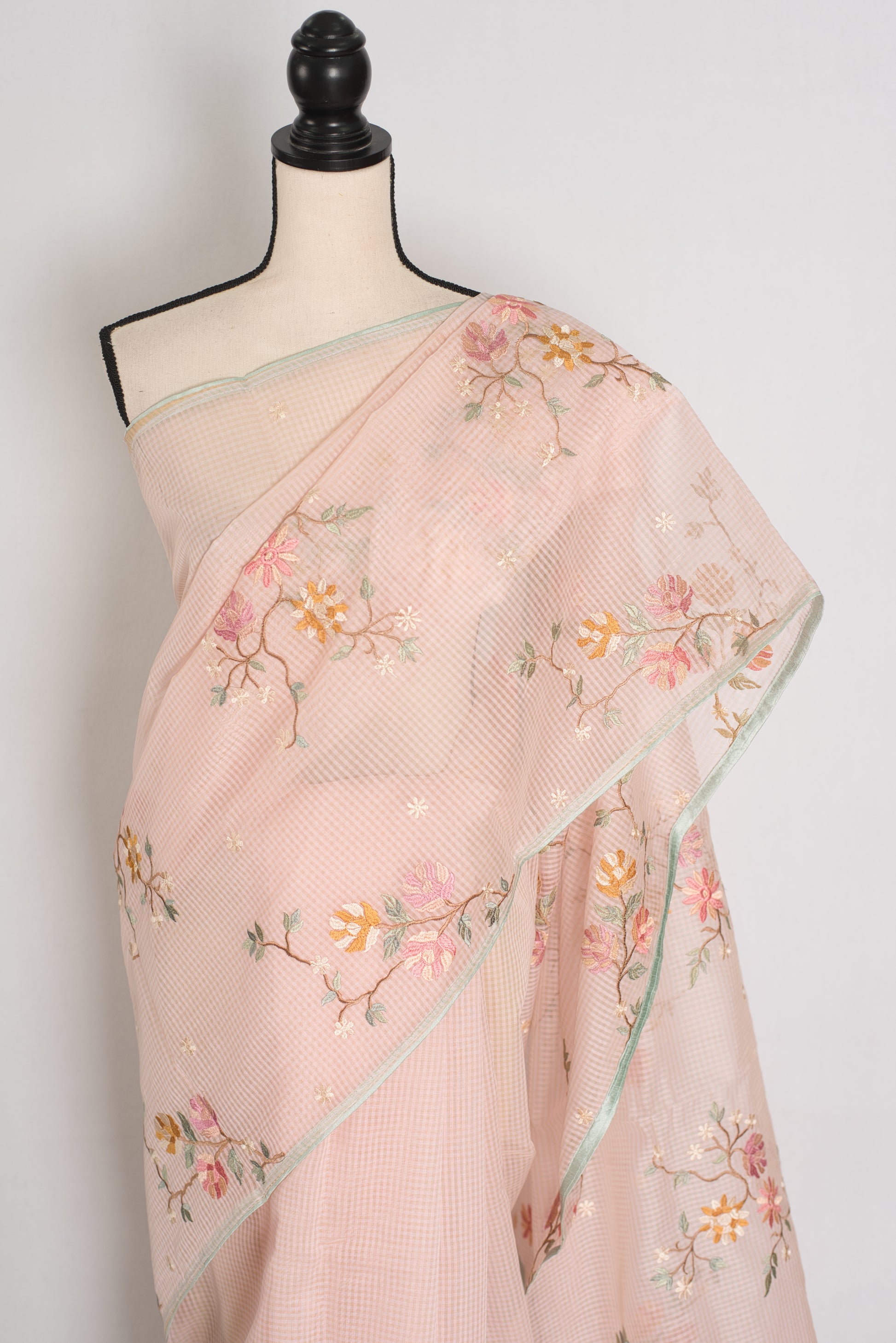 Rohini collection: Pink blended cotton kota saree with floral embroidery, self checks, and sky blue piping border.
