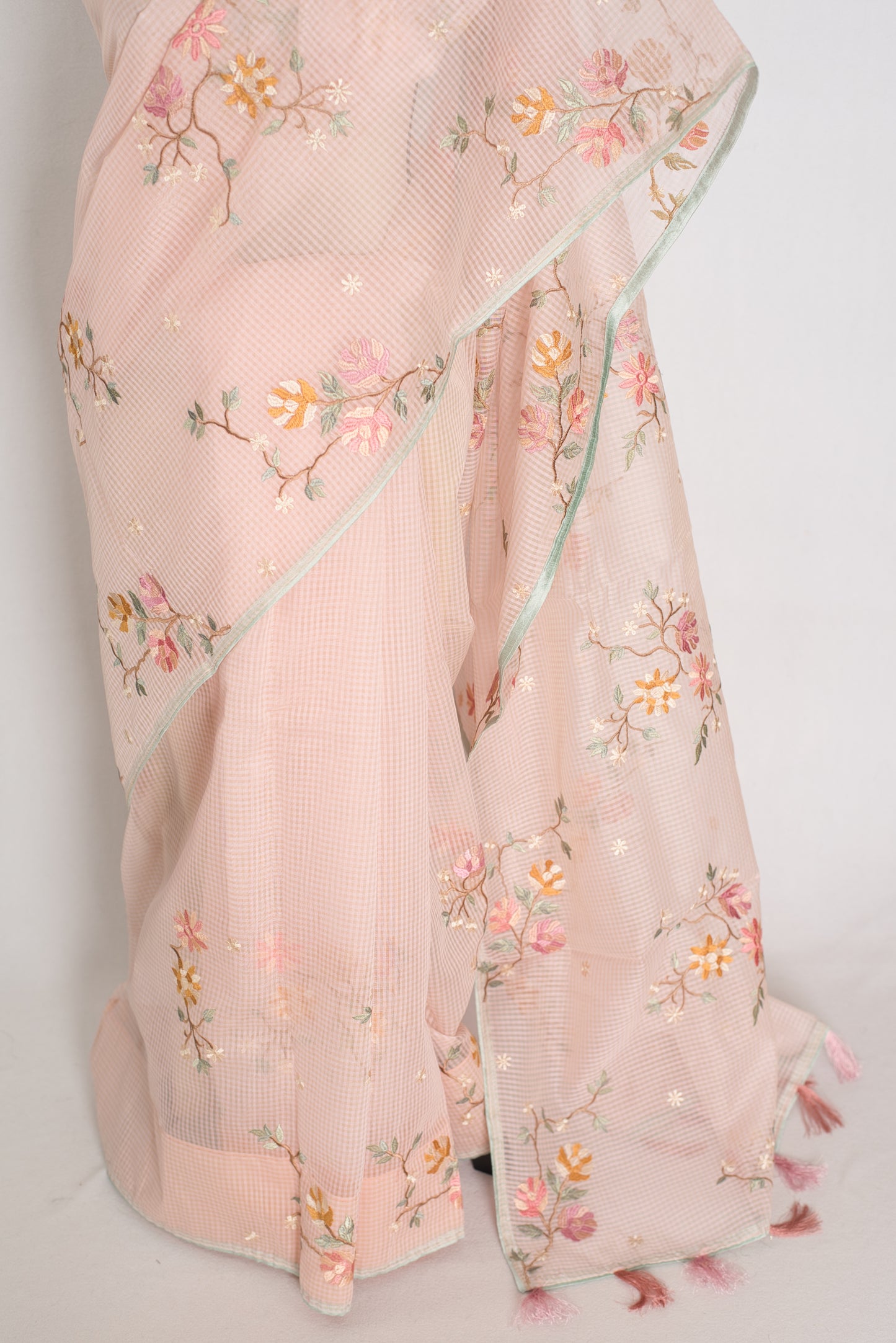 Rohini collection: Pink blended cotton kota saree with floral embroidery, self checks, and sky blue piping border.