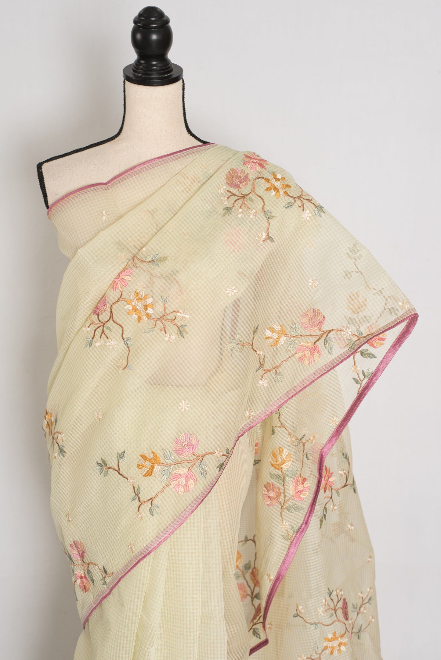 Ragini collection: Sea green blended cotton kota saree with pink floral machine embroidery and pink piping border.