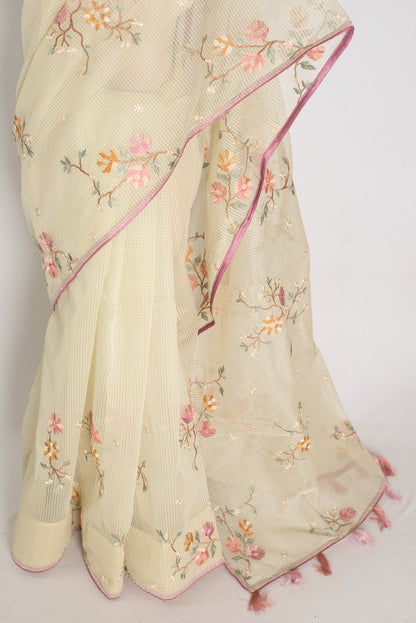 Ragini collection: Sea green blended cotton kota saree with pink floral machine embroidery and pink piping border.
