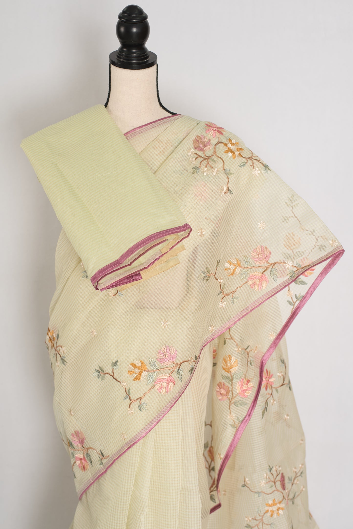 Ragini collection: Sea green blended cotton kota saree with pink floral machine embroidery and pink piping border.