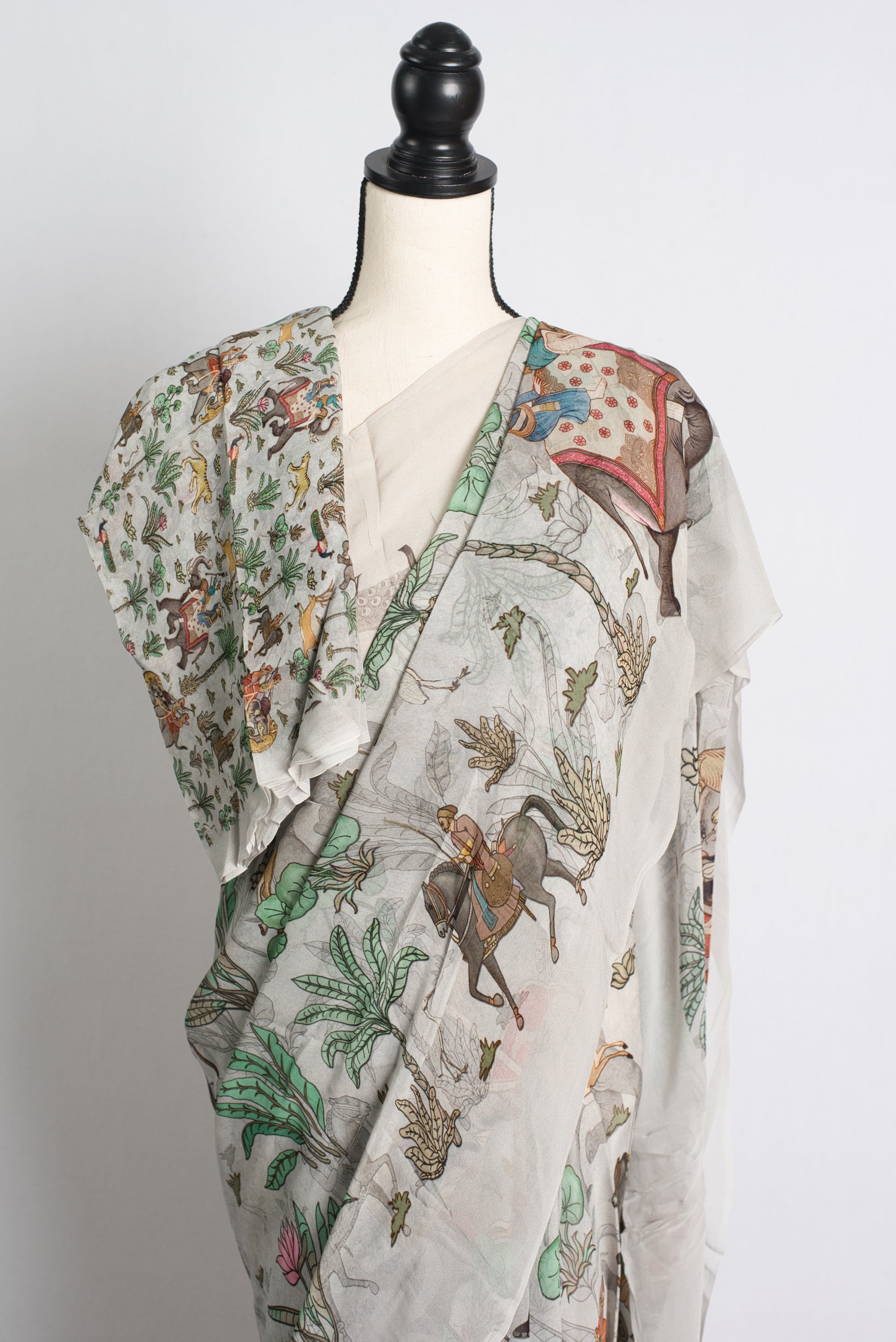 Grey Georgette Saree with Unique Prints Depicting a Hunting Scene.