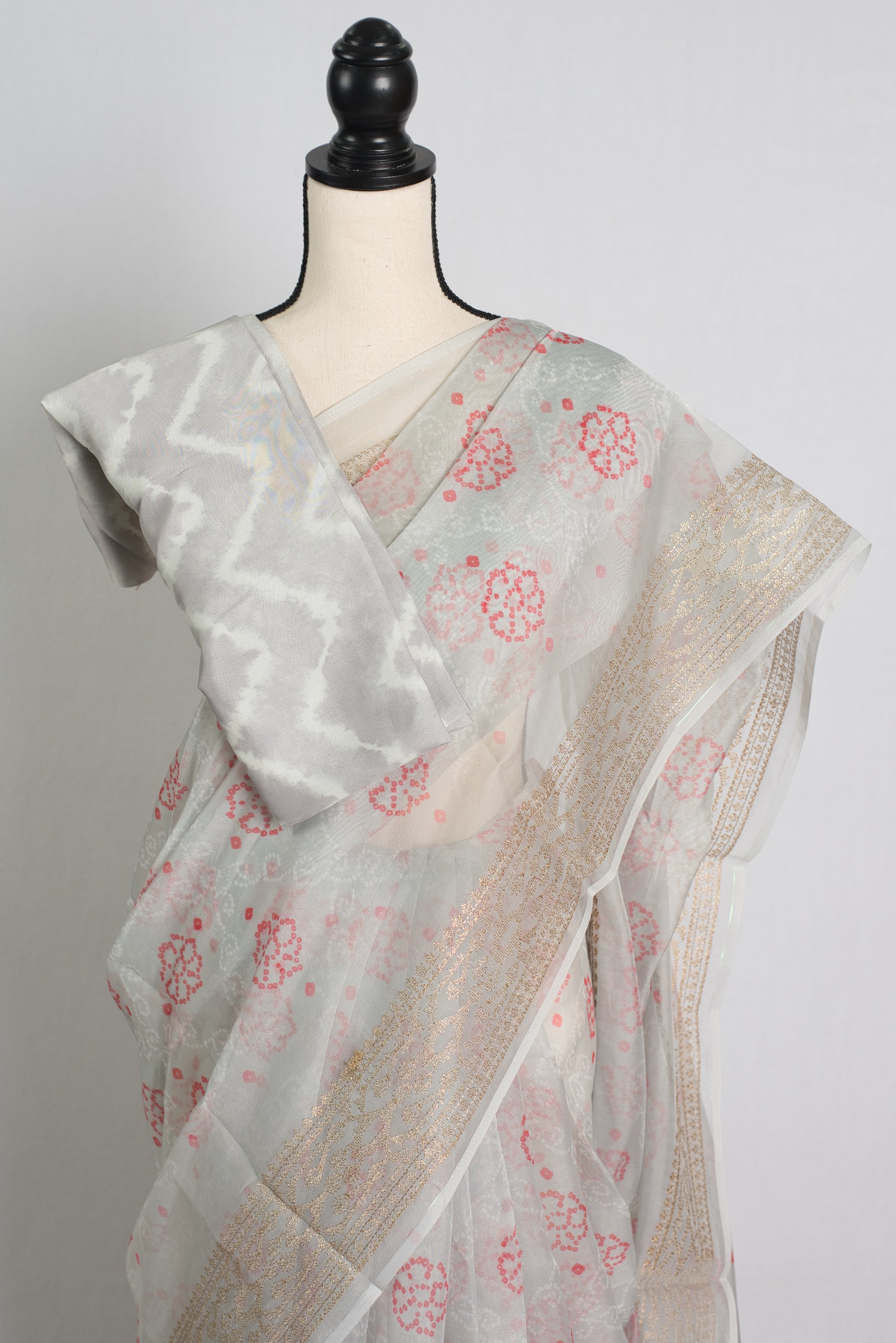 Grey Semi Organza Bandhani Saree with Zari Thread Embroidery Border.