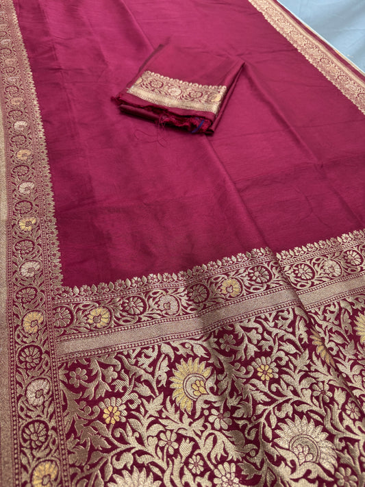 Maroon fabric with intricate gold embroidery