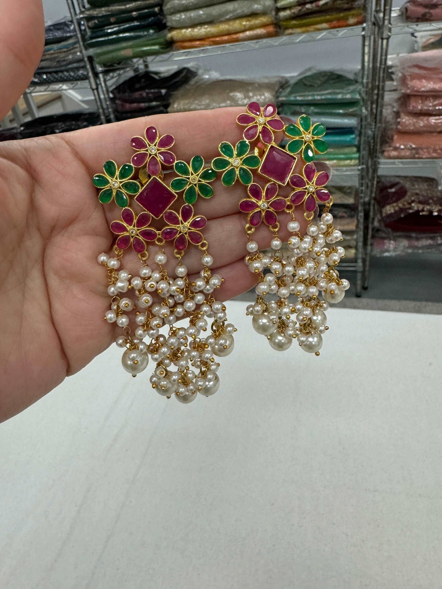 Gold Polished Jaipur Indian Earrings with Red and Green Stones.