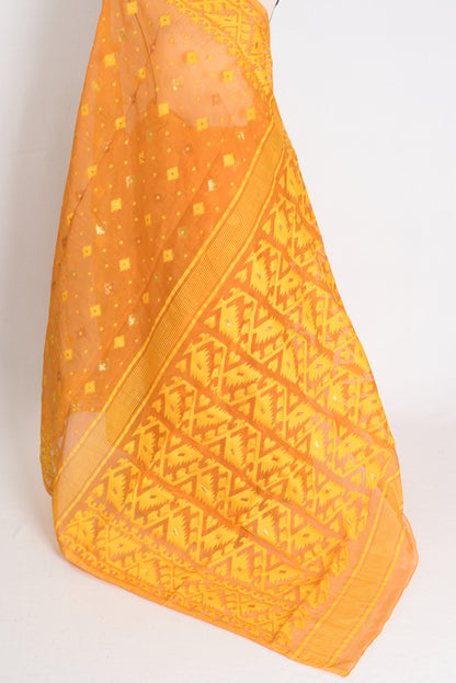 An earthy brown and yellow blended Jamdani saree in soft cotton, featuring traditional Bengali hand-loomed motifs and a sophisticated matte finish.