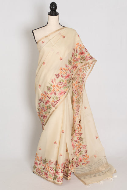 Beige saree with floral patterns on a mannequin against a white background