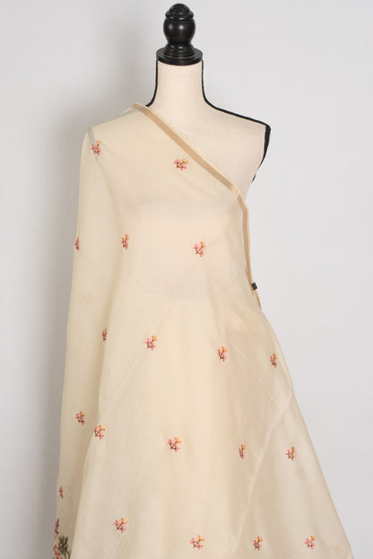 Beige dress with floral embroidery on a mannequin against a white background