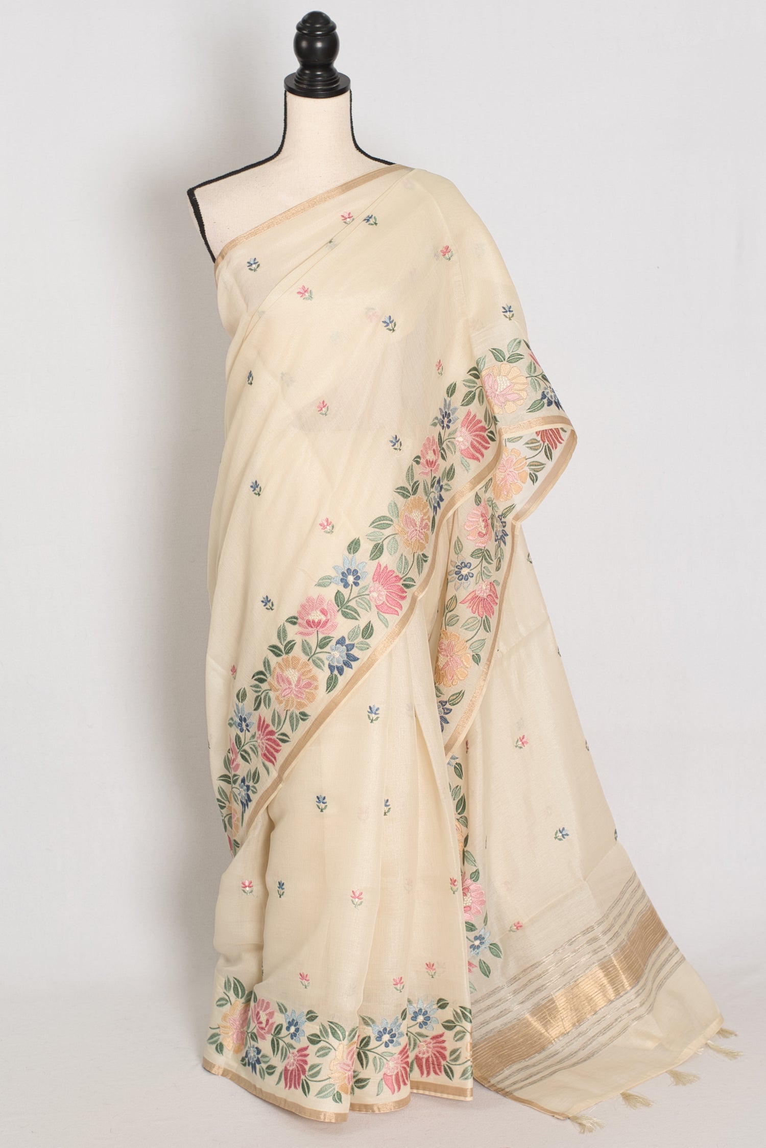 Beige saree with floral patterns on a mannequin against a white background