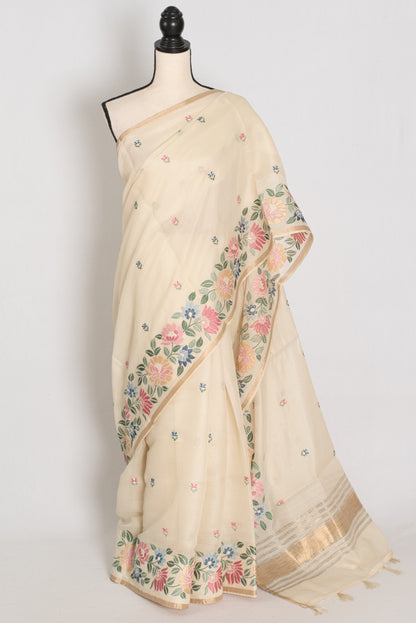 Beige saree with floral patterns on a mannequin against a white background
