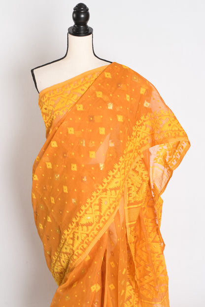 An earthy brown and yellow blended Jamdani saree in soft cotton, featuring traditional Bengali hand-loomed motifs and a sophisticated matte finish.