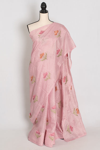 Pink saree with floral patterns on a mannequin against a white background