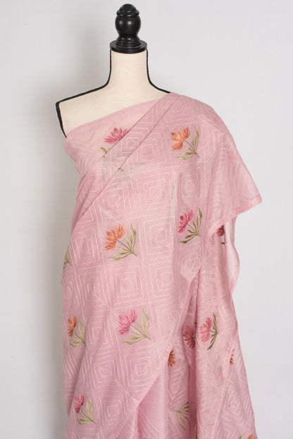 Pink saree with floral embroidery on a mannequin against a white background