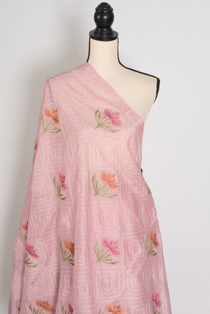 Pink saree with floral embroidery on a mannequin against a white background