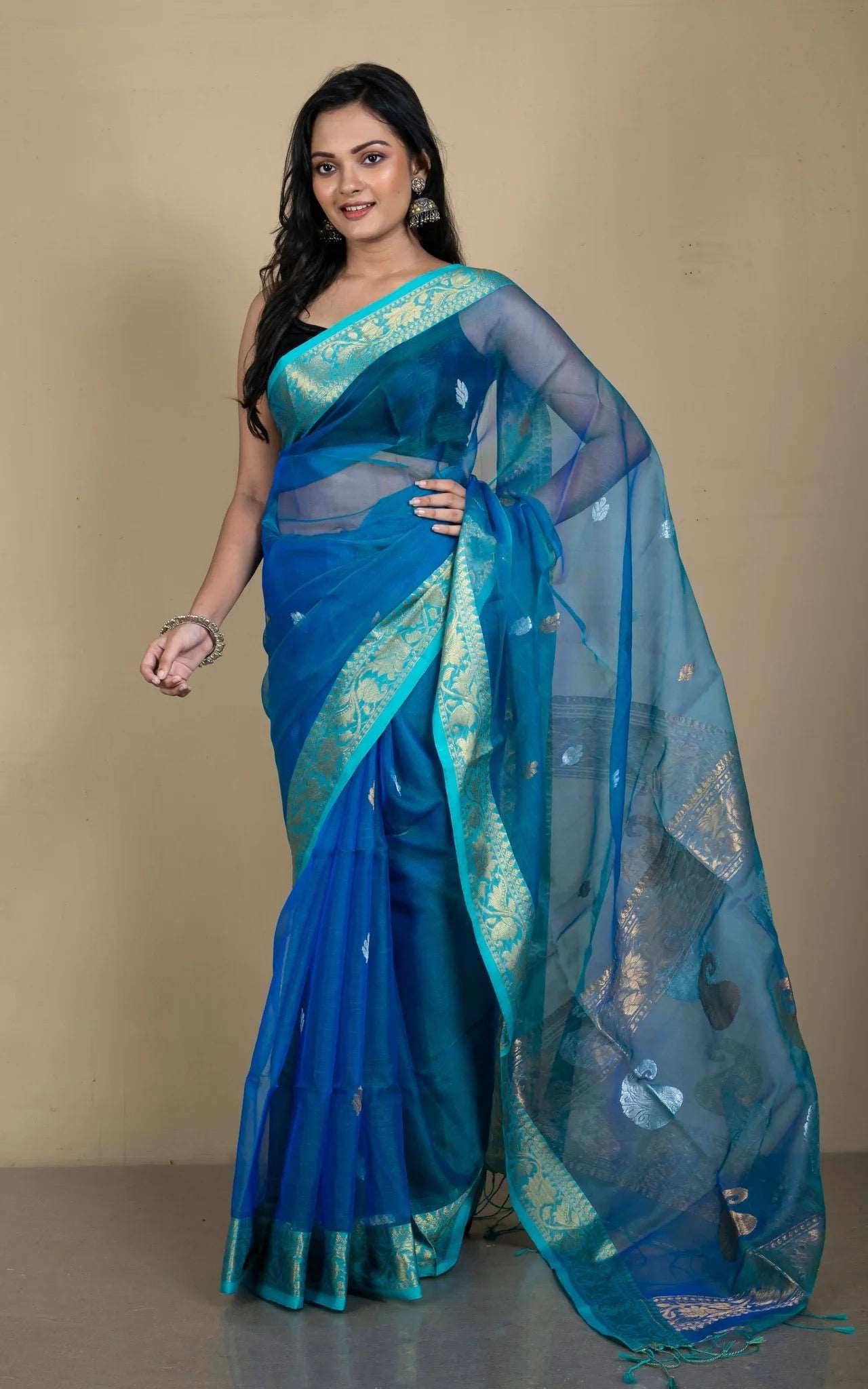 Semi Muslin Silk Banarasi Saree in Peacock Blue.