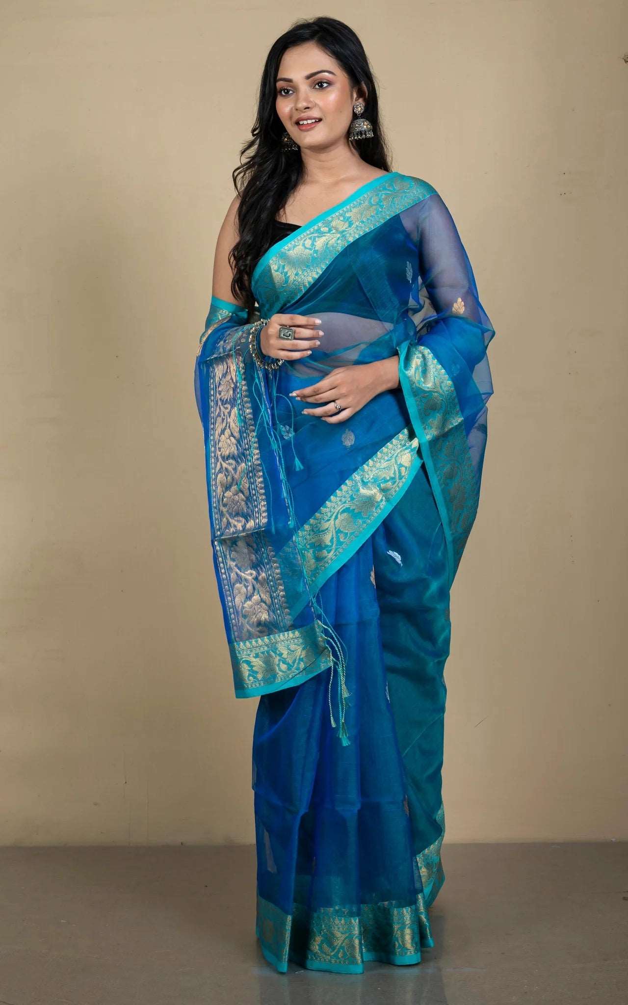 Semi Muslin Silk Banarasi Saree in Peacock Blue.