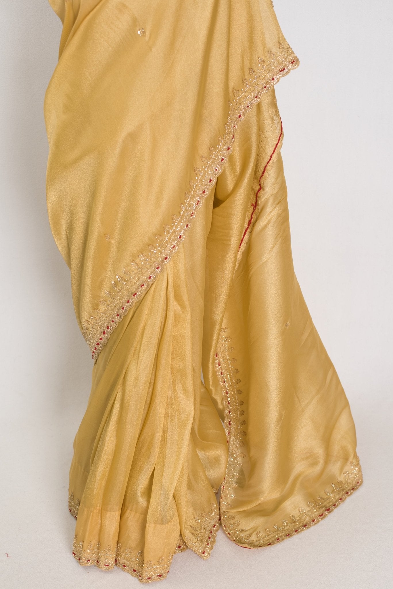 Nagma | Soft Tissue Gold Designer Saree with Hand Embroidery Border - Saree Mandi