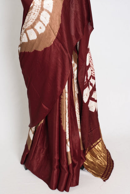Nirja : Modal Silk Bandhani Partywear Saree in Maroon and Gold - Saree Mandi