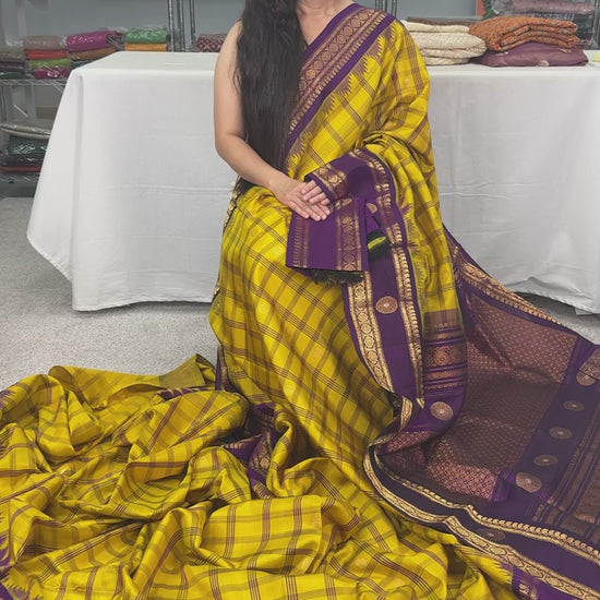 Video of Nandini: Yellow and Purple Checks Handwoven Gadwal Silk Saree with Golden Zari.
