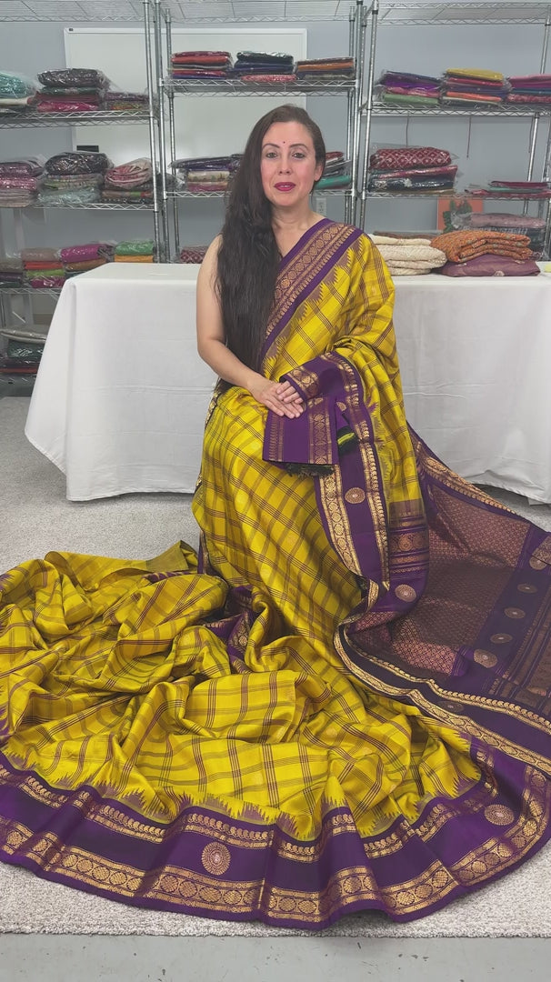 Video of Nandini: Yellow and Purple Checks Handwoven Gadwal Silk Saree with Golden Zari.